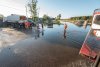 В Ромненском районе вода подтопила участки и дорогу